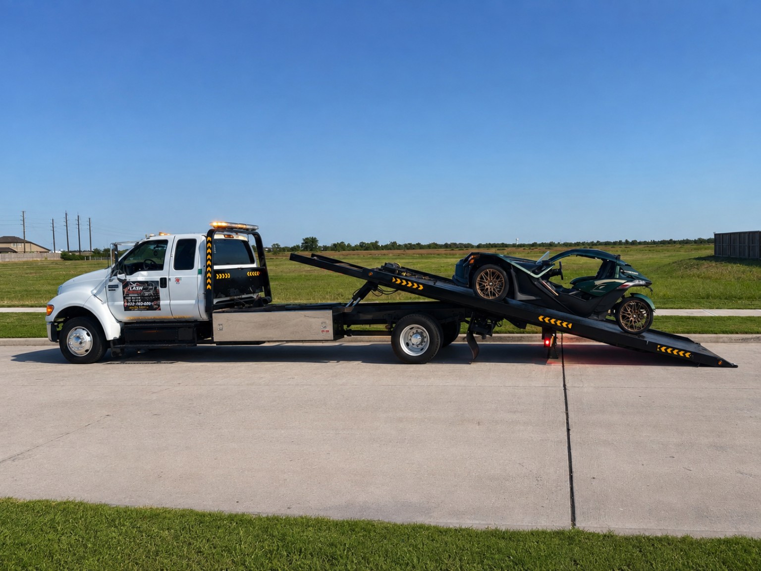 Flash Towing truck transporting a car in daylight